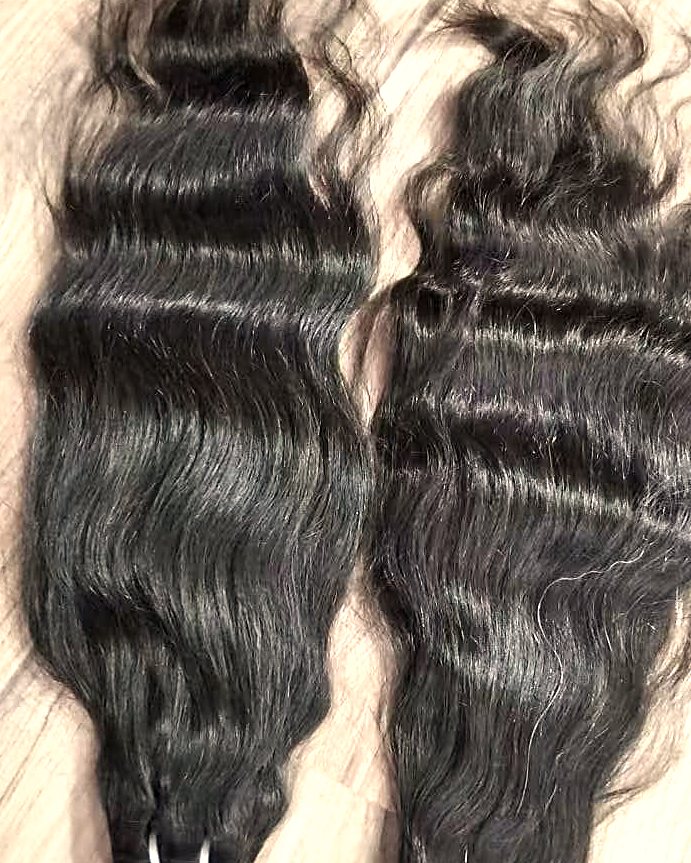 Two bundles of natural wavy Indian hair laid side by side